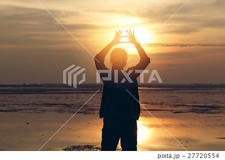 Silhouette woman lifestyle relax at sunset  27720554