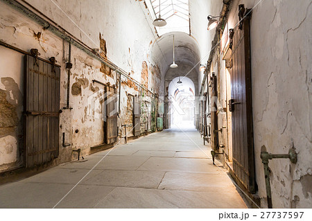 Jail hallway with locked doors. 27737597