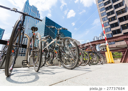 Bicycle parking between skyscrapers. 27737684