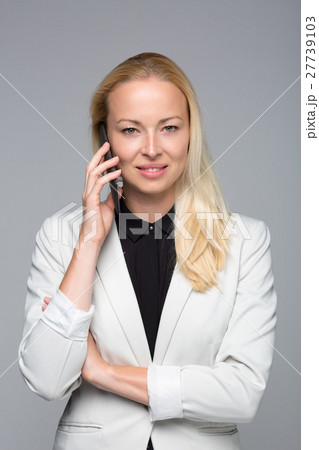 Beautiful young caucasian businesswoman talking on 27739103
