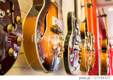 Beautiful sunburst electric guitar in the shop Beautiful sunburst electric guitar in the shop 27739727