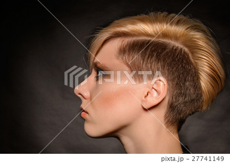 girl with a short stylish haircut on a dark back 27741149