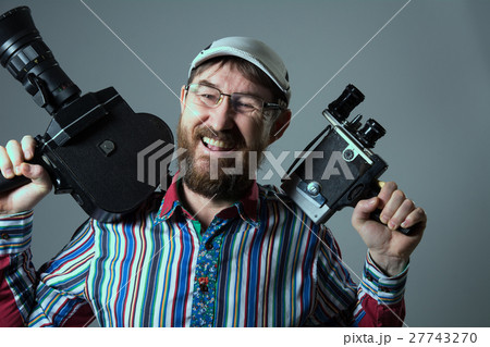 Laughing bearded man two old retro film camera Laughing bearded man two old retro film camera 27743270