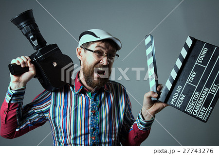 Screaming male retro movie camera and clapperboard 27743276