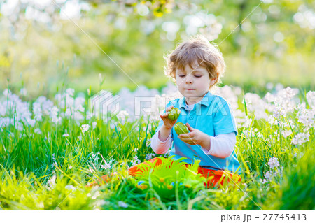 little kid boy having fun with traditional Easter little kid boy having fun with traditional Easter 27745413
