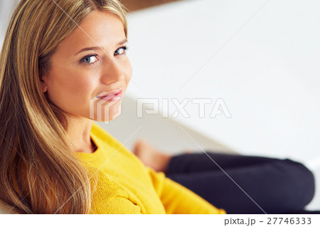 Young woman sitting on the couch 27746333
