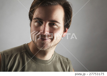 Portrait of an attractive man with green shirt Portrait of an attractive man with green shirt 27753175