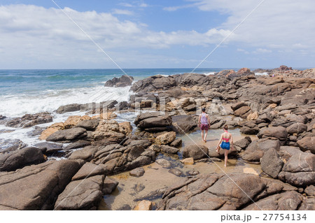 Girl Boy Walking Beach Rocks Ocean Girl Boy Walking Beach Rocks Ocean 27754134