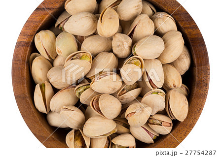 Heap of salted pistachio nuts Heap of salted pistachio nuts 27754287