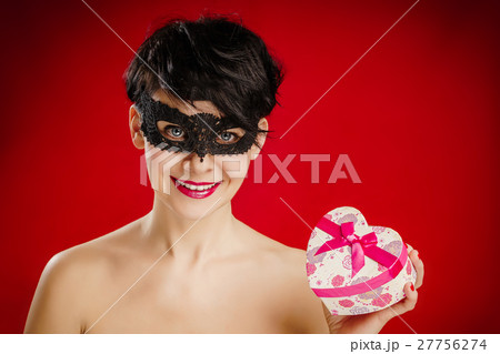 woman in a mask with a gift woman in a mask with a gift 27756274