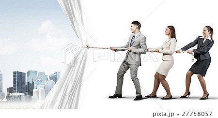 Young businesspeople working in collaboration and pulling white advertisement banner Young businesspeople working in collaboration and pulling white advertisement banner 27758057