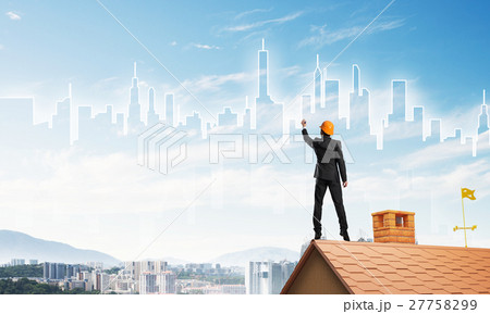Man architect draw silhouette of modern city on blue sky. Mixed media Man architect draw silhouette of modern city on blue sky. Mixed media 27758299