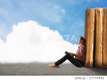 young woman reading a book young woman reading a book 27758482