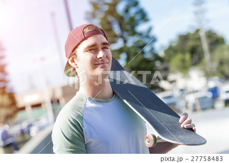 Handsome guy with skateboard 27758483