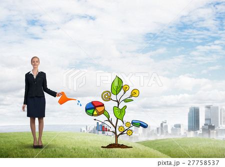 Young businesswoman outdoors watering drawn growth concept with can 27758537