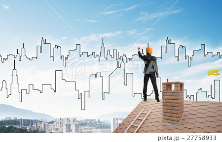Man architect draw silhouette of modern city on blue sky. Mixed media 27758933