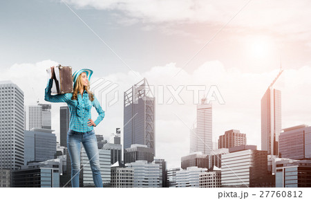 Attractive girl with old suitcase 27760812