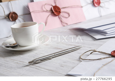Letter with seal on table 27766295