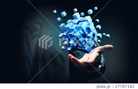 Cube in female hand 27767182