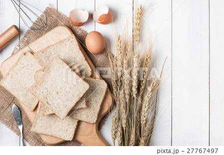 Bread wheat on old white wood background Bread wheat on old white wood background 27767497