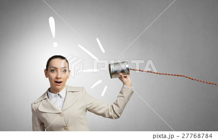 Woman using deaf phone Woman using deaf phone 27768784