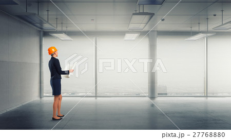 Woman designer in interior 27768880