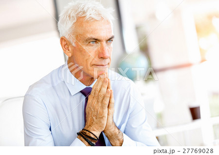 Businessman at the office Businessman at the office 27769028