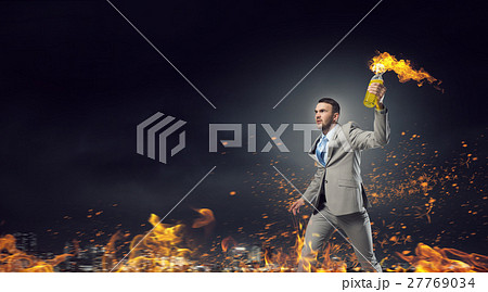 Businessman throwing petrol bomb Businessman throwing petrol bomb 27769034