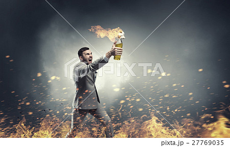 Businessman throwing petrol bomb Businessman throwing petrol bomb 27769035