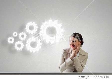 Businesswoman sitting at desk 27770430