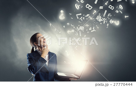 Woman with laptop in hands Woman with laptop in hands 27770444