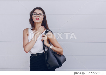 beautiful brunette with glasses 27777908