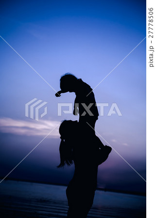 Silhouette of mother and child enjoying the view 27778506