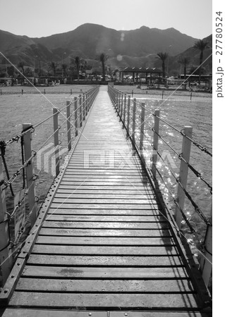 Pontoon on the Red Sea. Wooden bridge over the sea Pontoon on the Red Sea. Wooden bridge over the sea 27780524