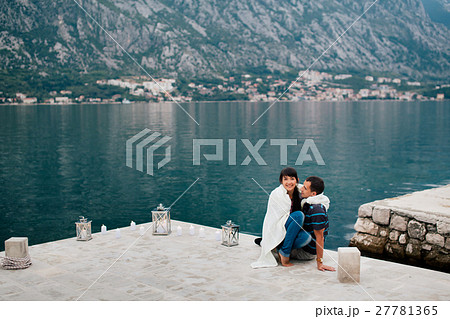 couple on the beach with candles couple on the beach with candles 27781365