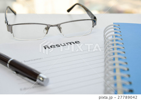 Draft of Resume with pen, notebook and eyeglasses Draft of Resume with pen, notebook and eyeglasses 27789042