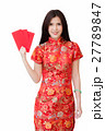 asian woman wearing red dress holding 27789847
