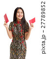 Asian woman wearing black dress holding money gift 27789852