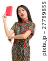 Asian woman wearing black dress holding money gift 27789855