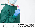 surgeon holding test tube for analysis 27789859