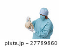 surgeon is pointing finger on skull 27789860