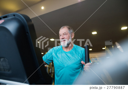 Fit senior man in gym doing cardio work out. 27790887