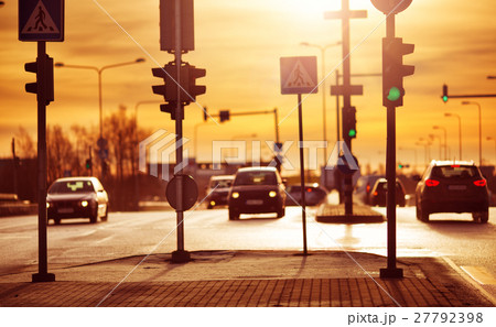 Cars moving on the road in city in early morning Cars moving on the road in city in early morning 27792398