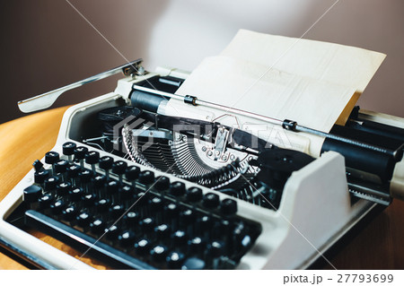 Retro old typewriter with paper sheet 27793699