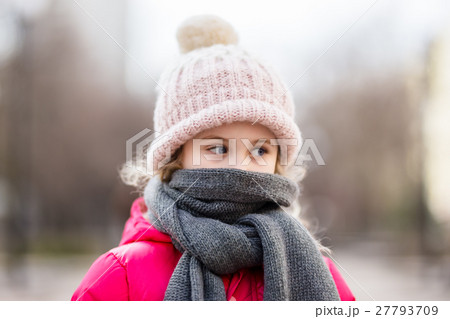 Closeup portrait of cute baby girl wearing knitted 27793709