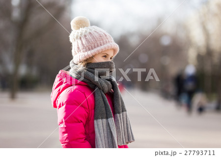 Closeup portrait of cute baby girl wearing knitted 27793711