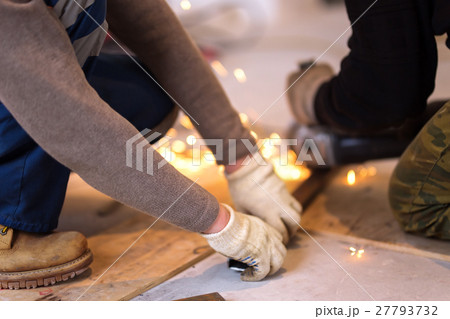 Cutting metal with angle grinder. Cutting metal with angle grinder. 27793732