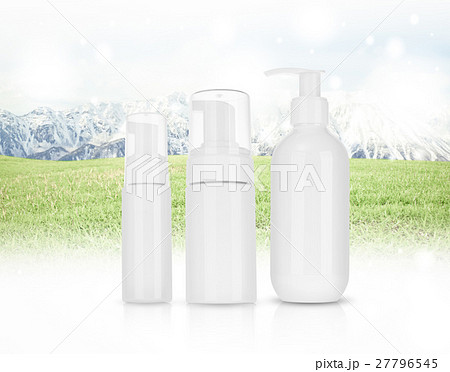 Cosmetic product for cream, foam, shampoo. on Panorama of Mountain Snow Landscape with green grass . 27796545