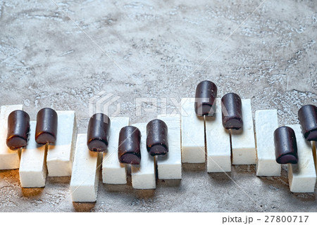 Piano keys laid out chocolates candy  27800717