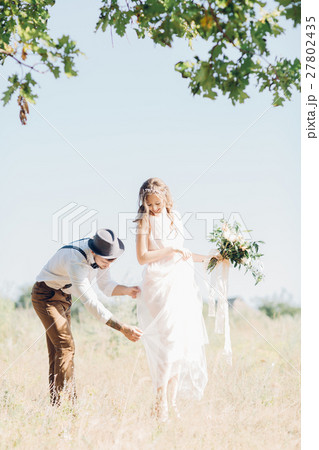 bride and groom hugging at the wedding in nature. 27802435